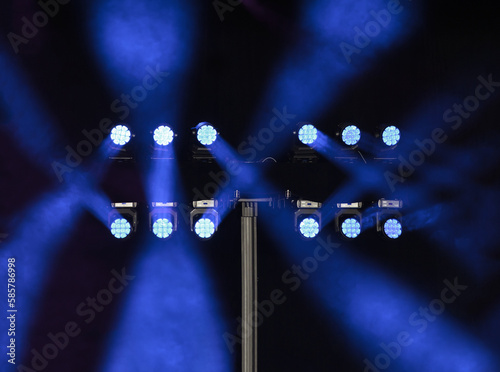 Stage lighting. Professional blue spotlights in the dark. © OneClic