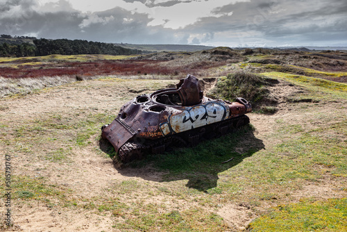 Tank Sherman M4 wreckage from WW2 in sand dunes of Normandy