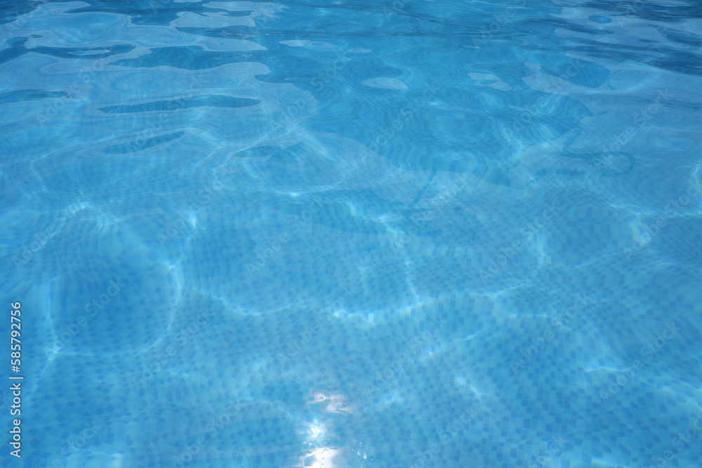 Blue Water surface. Blue ripped water in swimming pool.
summer concept blue water elements.