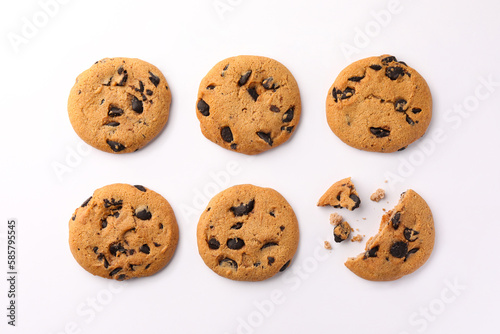 Delicious chocolate chip cookies on white background, flat lay