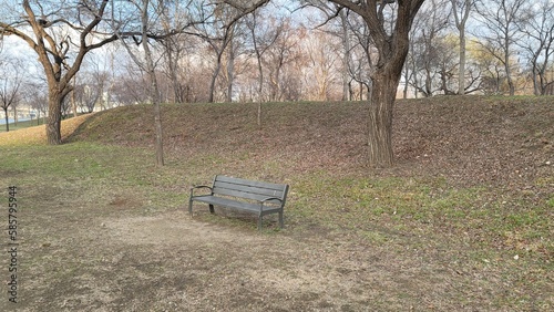 a bench in an open-air park bench