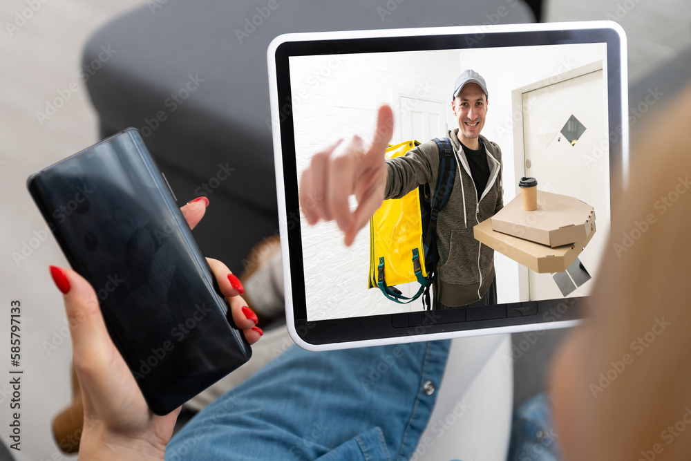 Delivery Man Using Remote Delivery man ringing door bell on cctv secure camera system on tablet ...