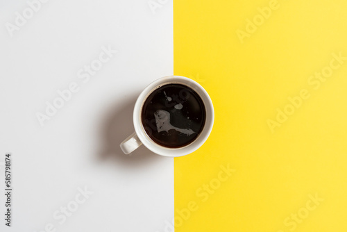 simple classic hot cup of tea view from above, colorful background with copy space