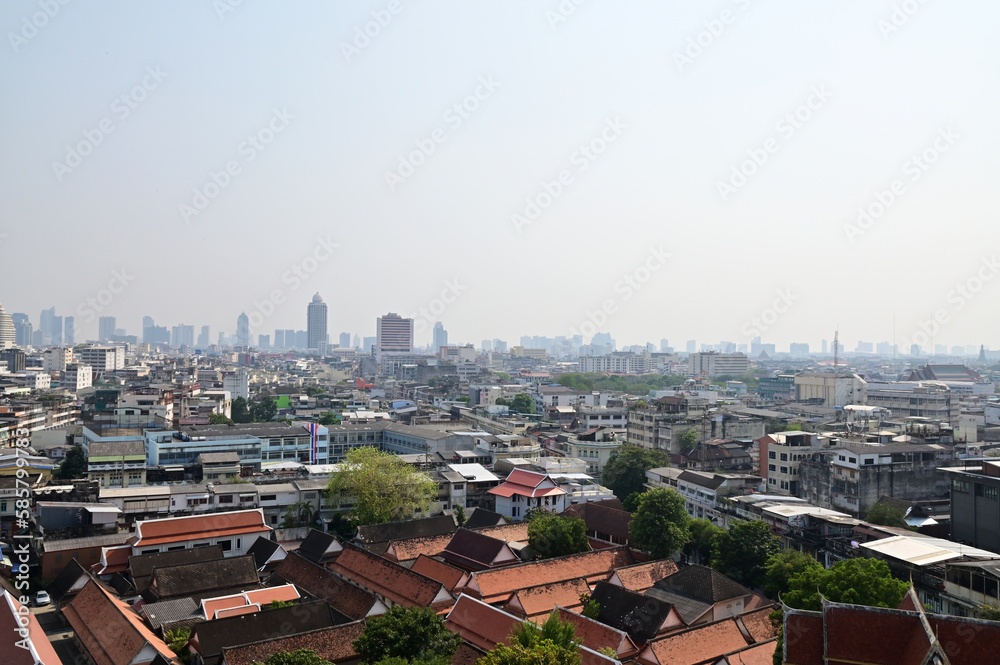 BANGKOK, THAILAND - April 12, 2023 : Landscape View of Bangkok City and Thai Buddhist Temple with Blue sky with white cloud. Clear day and good weather in the morning.