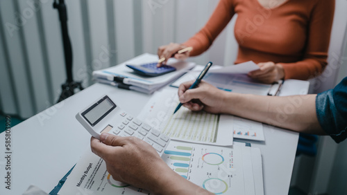 Business bookkeeping with calculator of bookkeeper and household calculating chart graph annual financial account.