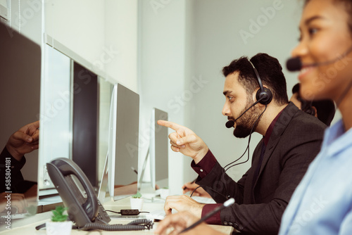 Group of call center business operator customer support team phone services working and talking with headset on desktop computer, Reception secretary answering client phone call at customer service