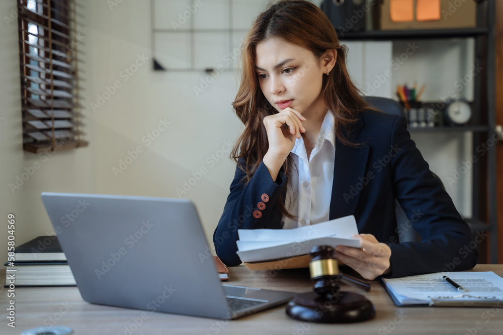 Lawyer woman working with paperwork on his desk in office workplace for consultant lawyer in office. Lawyer woman working with paperwork on his desk in office workplace for consultant lawyer in office.
