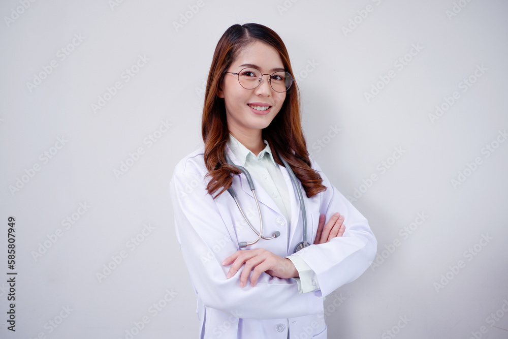 Smiling Asian female doctor with arms crossed medical concept. Smiling Asian female doctor with arms crossed medical concept.