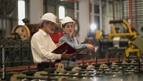 A new generation of engineers in a metal sheet factory.  Studying work methods from supervisors or colleagues and studying by yourself  be taught professionally