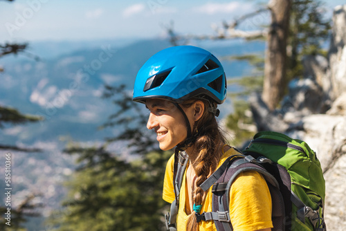 Portrait of a woman in a helmet for mountaineering and climbing. Safety in extreme sports. outdoor sports, fit and active women.