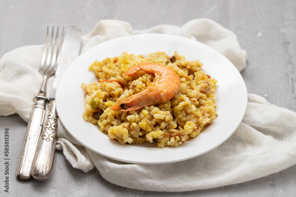 Mixed rice with seafood on small white dish Mixed rice with seafood on small white dish