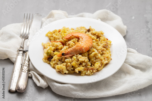 Mixed rice with seafood on small white dish