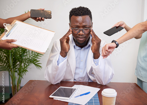 Фотография Stressed and overwhelmed doctor concept, priorities and healthcare workload