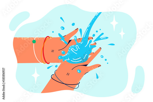Close-up hand with jet of water in process of disinfection after walk to get rid of bacteria and germs