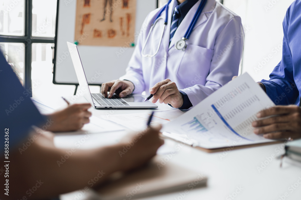 Team, medical analysts and doctors consulting with paperwork of graphs, data and charts in hospital conference room. Healthcare staff discussing statistics, results of research and innovation.