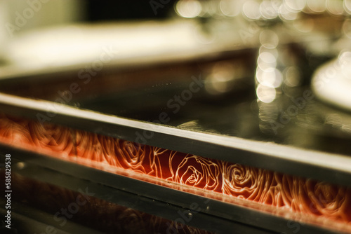 Close-up of ed bathroom tile with roses