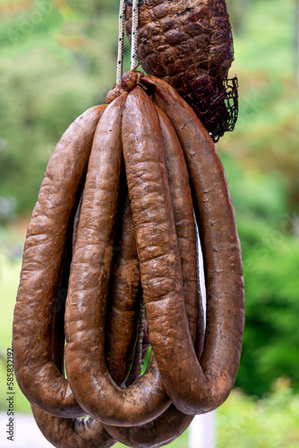 Freshly prepared traditional smoked sausage from different types of meat.