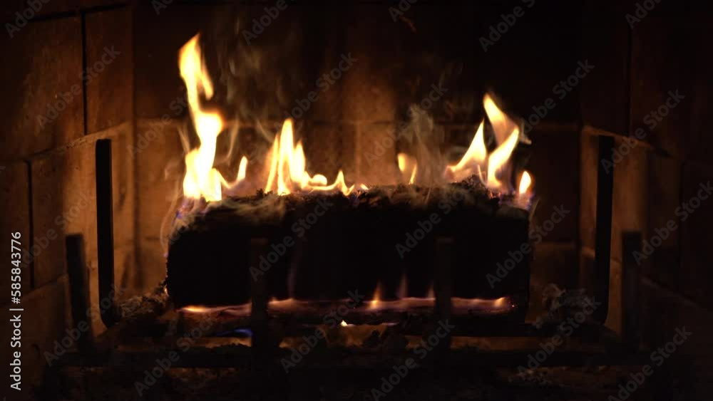 Cozy Fireplace with wax log close up Cozy Fireplace with wax log close up