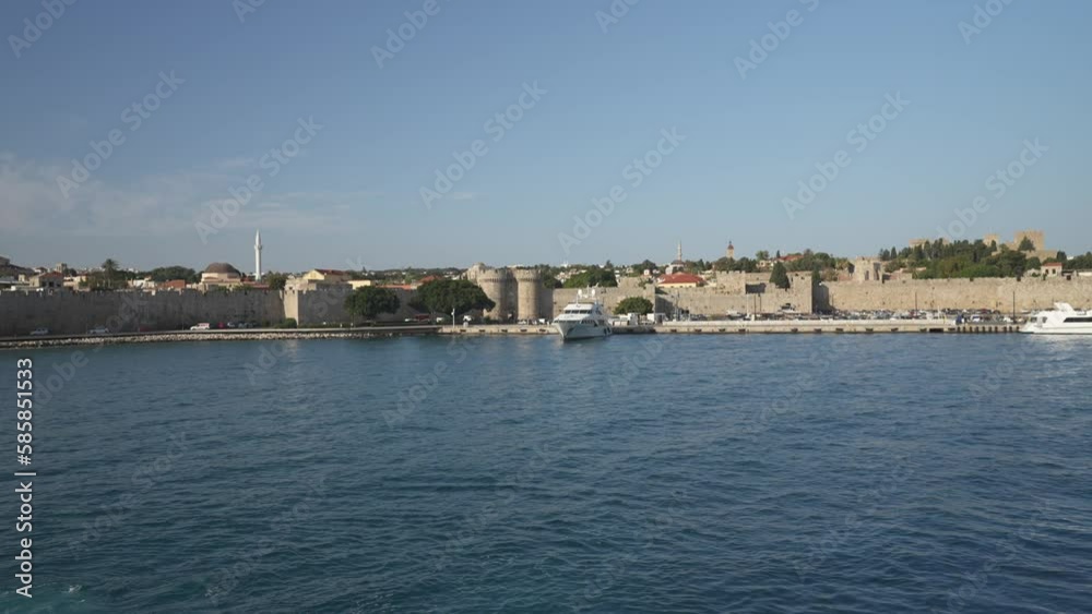 Shot of Rhodes Town from ferry leaving port, Rhodes Old Town, Rhodes, Dodecanese Islands, Greek Islands, Greece, Europe Shot of Rhodes Town from ferry leaving port, Rhodes Old Town, Rhodes, Dodecanese Islands, Greek Islands, Greece, Europe