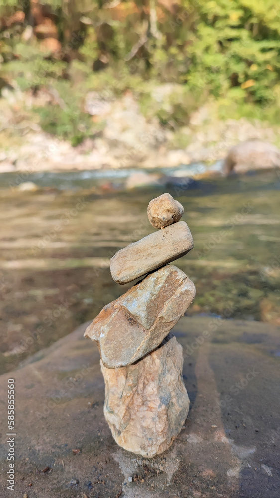 Cairn in balance by the river