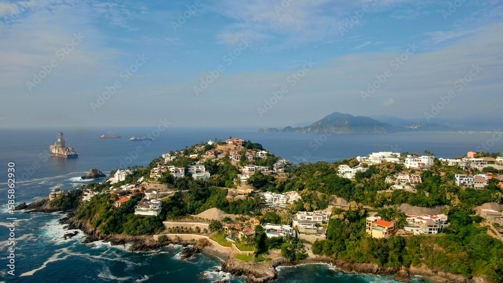 Aerial view of Peninsula de Santiago in city Manzanillo, Mexico. Beautiful bitch and luxury hotels and boat and yacht berth