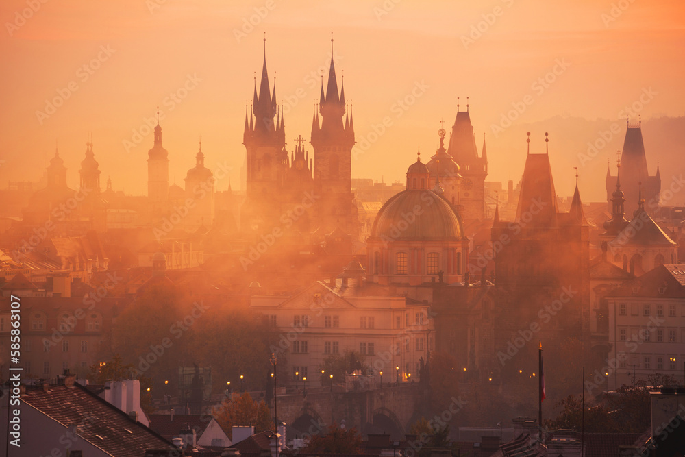Fog over Prague Towers at beautiful sunrise, view from the Mala Strana , City of a Hundred Spires - Prague, Bohemia, Czech Republic at sunrise
