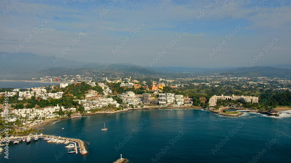 Aerial view of Peninsula de Santiago in city Manzanillo, Mexico. Beautiful bitch and luxury hotels and boat and yacht berth