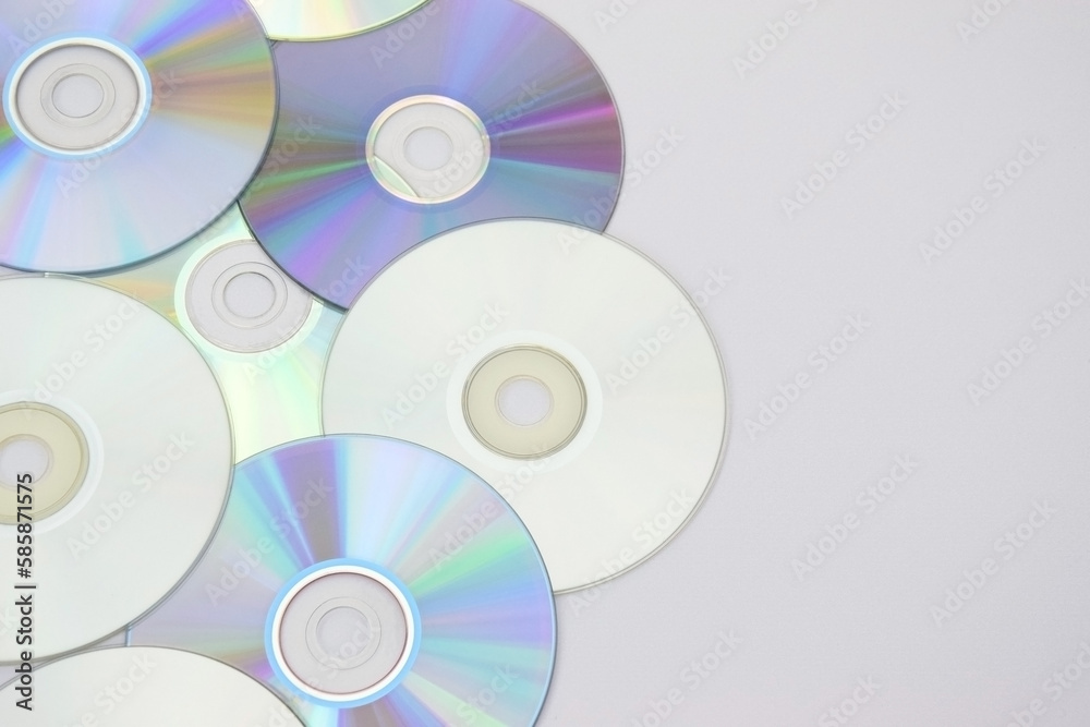 Lots of old CDs are laid out as a background. Lots of old CDs are laid out as a background.