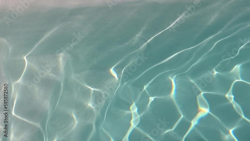 Caustics and Light Reflections in Turquoise Swimming Pool Water