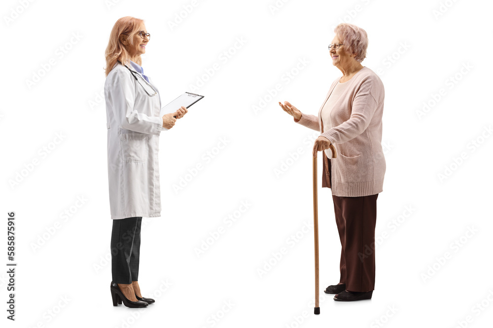 Full length profile shot of an elderly woman talking to a female physician