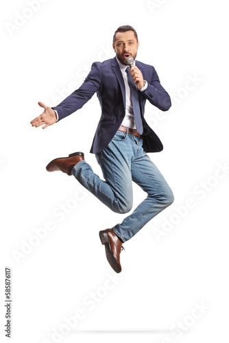 Excited man with a microphone jumping