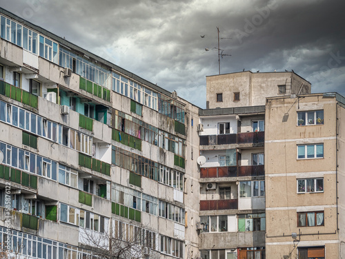 Billede på lærred Worn out apartment building from the communist era against blue sky in Bucharest Romania