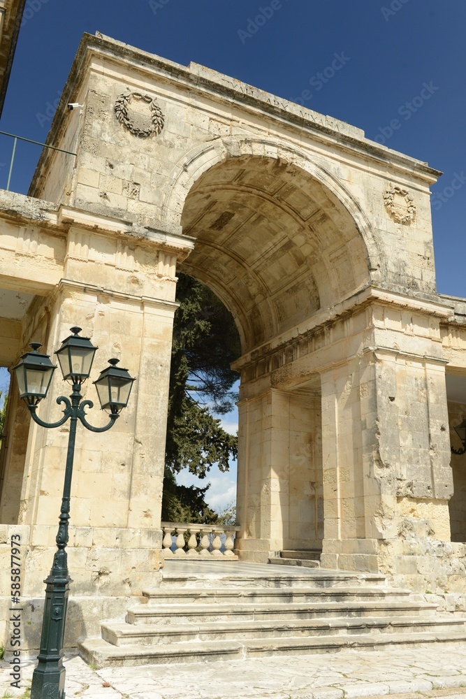 Corfu town, Corfu island, Greece- Classical Romanesque arch and part of the exterior decor of the Asian art museum in Spring.