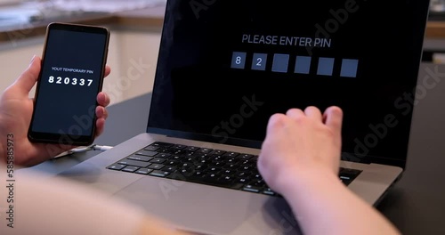 Woman hand enters one time password for verification process, secure mobile one time password verification method, two step authentication web page.