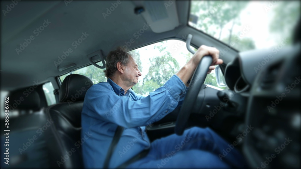 Obraz premium One senior man holding can steering wheel driving in city while talking in conversation out loud. Older male caucasian person driver commuting