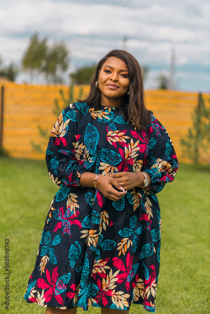 Portrait of beautiful african american woman having fun on village or suburbian. Outdoor portrait of a smiling african girl. Happy cheerful female laughing in countryside summer time and inclusion