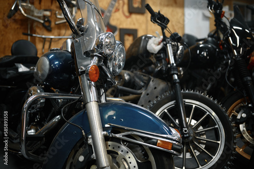 Motorcycles range in garage shop, repaired motorbikes ready for selling