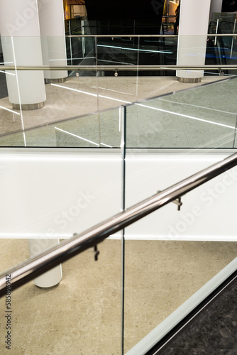 stainless steel railings and glass wall in modern building interior