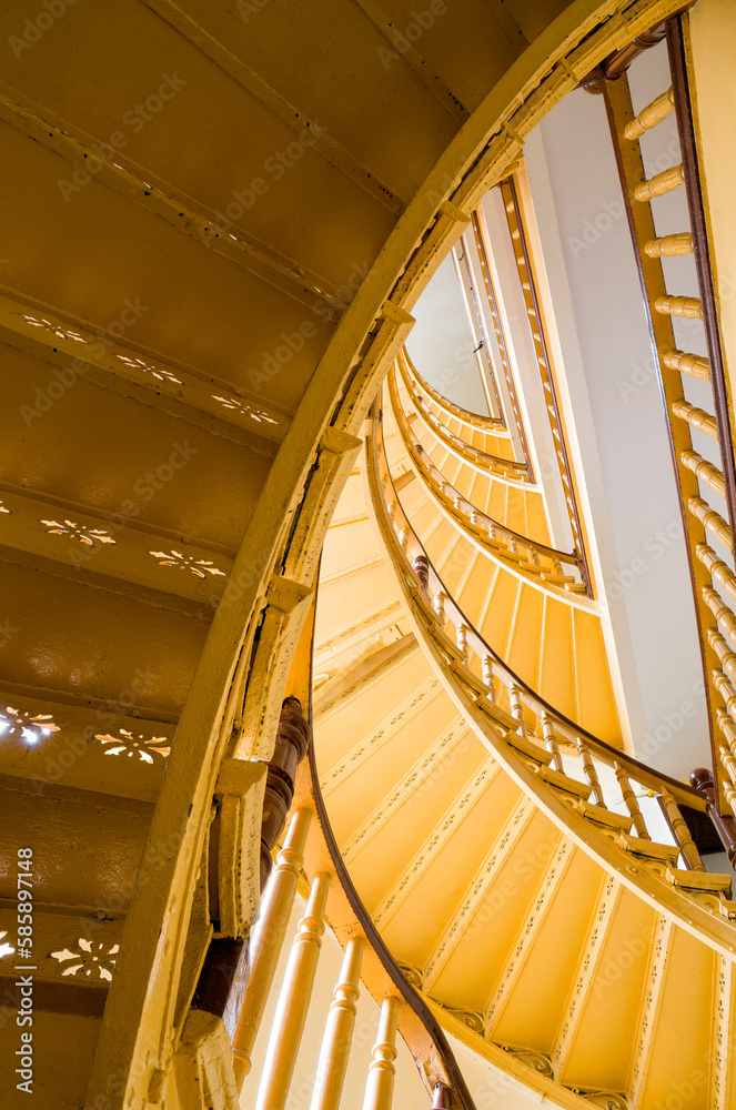 Fototapeta premium Yellow spiral staircase.