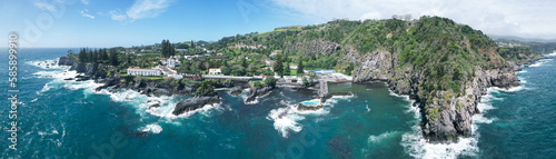 Drone view of the Caloura natural swimming pool, located in a seaside fishing village with great views and a secluded beach in the Sao Miguel island in the Azores, Portugal