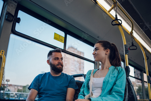 Friends talking while riding a bus in the city © Zamrznuti tonovi