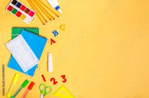 Stationery for training and various notebooks for writing on a yellow background.