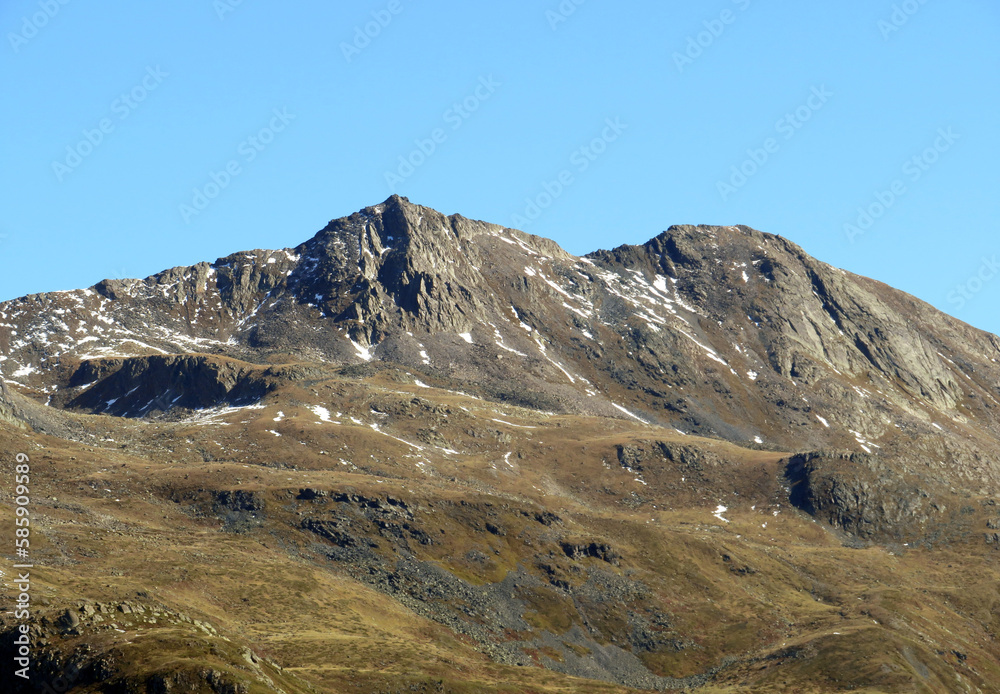 Rocky mountain peak Piz Chaste (2849 m) in the massif of the Albula Alps above the Swiss road pass Fluela (Flüelapass), Zernez - Canton of Grisons, Switzerland (Kanton Graubünden, Schweiz) Rocky mountain peak Piz Chaste (2849 m) in the massif of the Albula Alps above the Swiss road pass Fluela (Flüelapass), Zernez - Canton of Grisons, Switzerland (Kanton Graubünden, Schweiz)