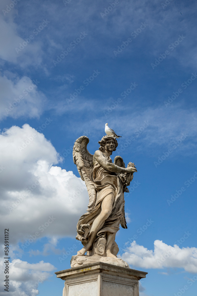 Angel statue on a pedestal at Ponte Sant Angelo in Rome, Italy.
