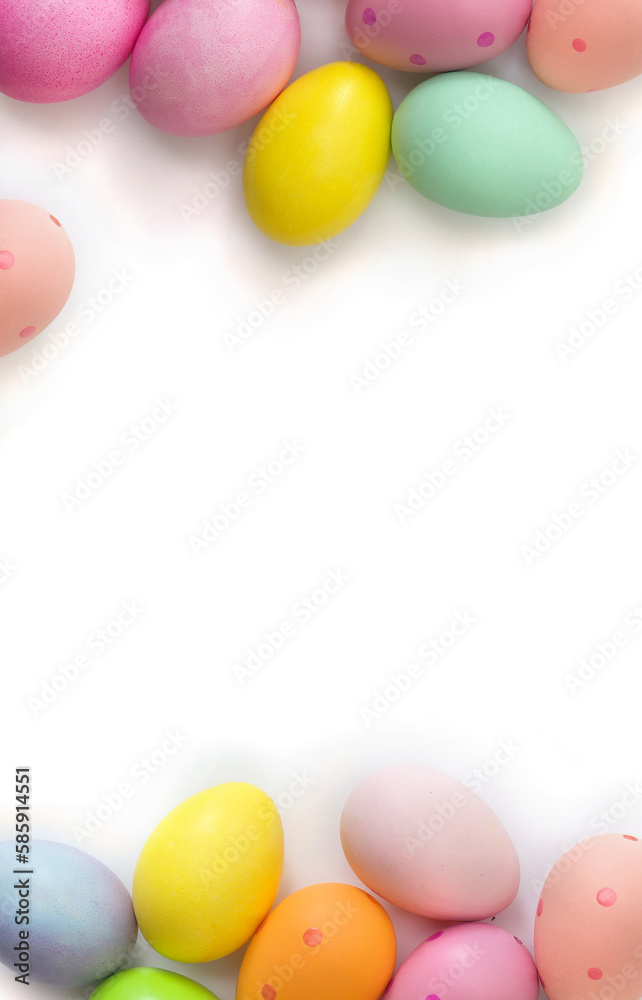 Easter decoration. Easter colorful eggs on a white background with space for text. Top view, flat lay