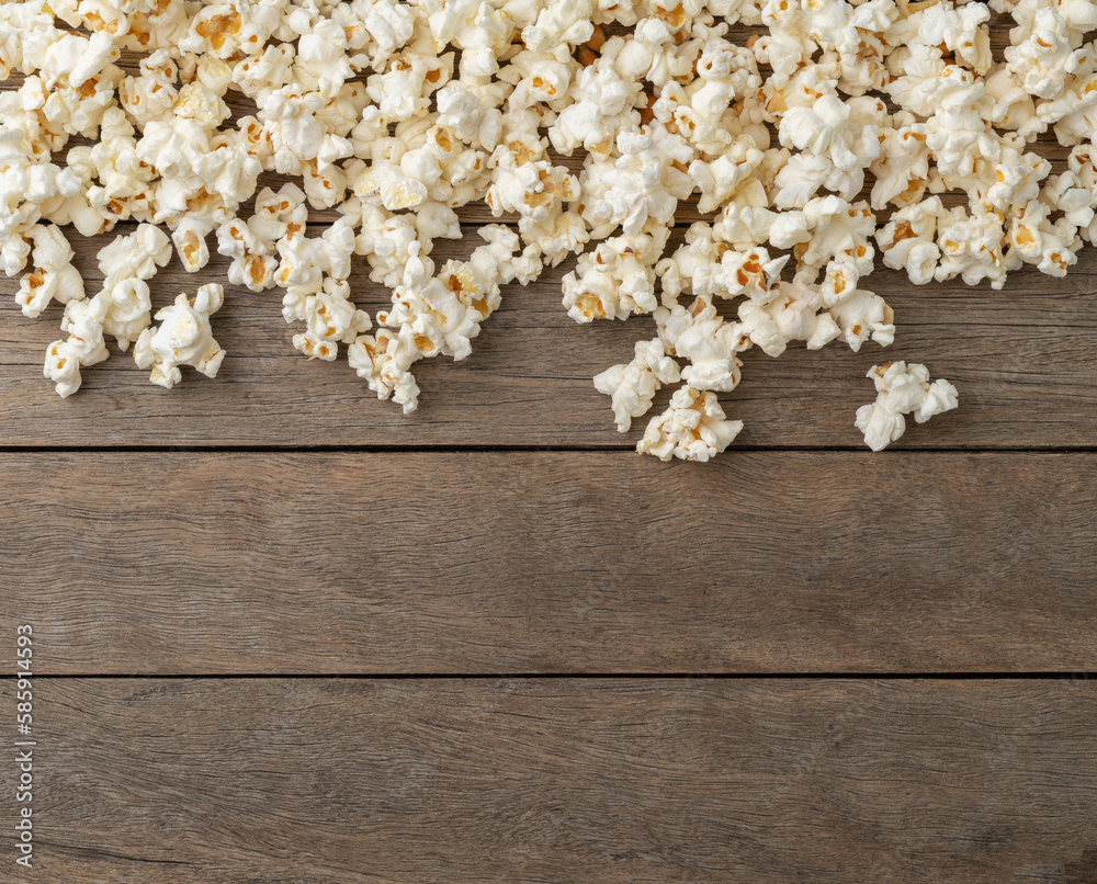 Popcorns over wooden table with copy space
