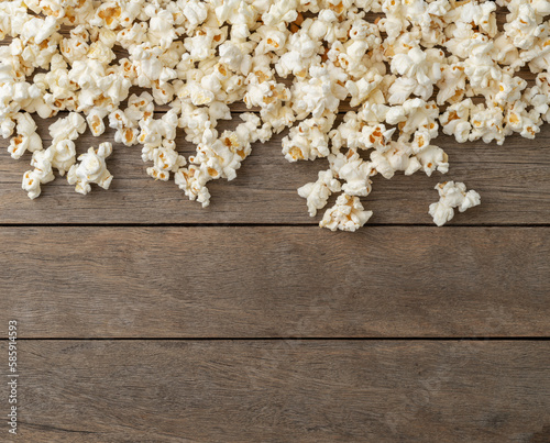 Popcorns over wooden table with copy space