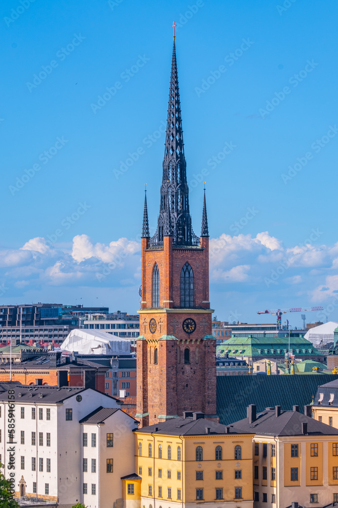 Pointed church tower on the island of Riddarholmen. Part of the former medieval abbey in Stockholm, Sweden. Burial site of most Swedish kings from the 17th century until 1950