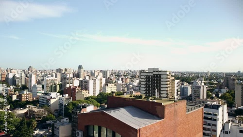 Nunez district of Buenos Aires, aerial view from drone flying up with view on highrise house buildings, sky horizon photo