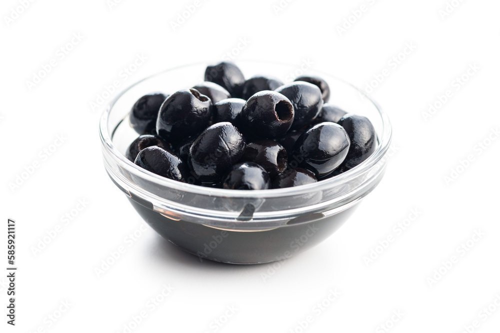 Pitted black olives in bowl isolated on white background. Pitted black olives in bowl isolated on white background.